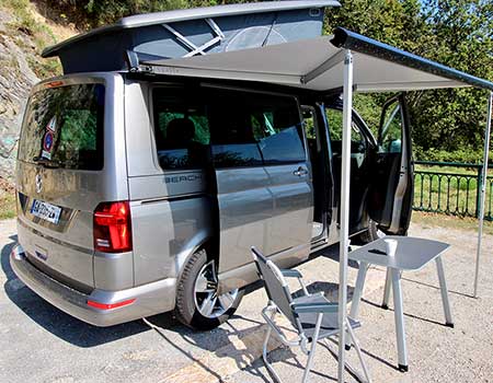 VW California Beach campervan with roof tent popped up