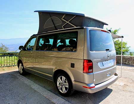 VW California Beach campervan with roof tent popped up