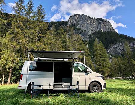 VW campervan with awning for rent in the French Alps