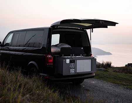 VW campervan on the coast with the exterior kitchen